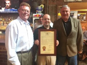 Rep. Redmon, CEO Terry Combs, & Rep. Walker with house resolution in honor of CVA's 35 Anniversary