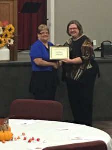 Photo of Connie Lambrecht and Nancy P accepting DSP of the Year 2017