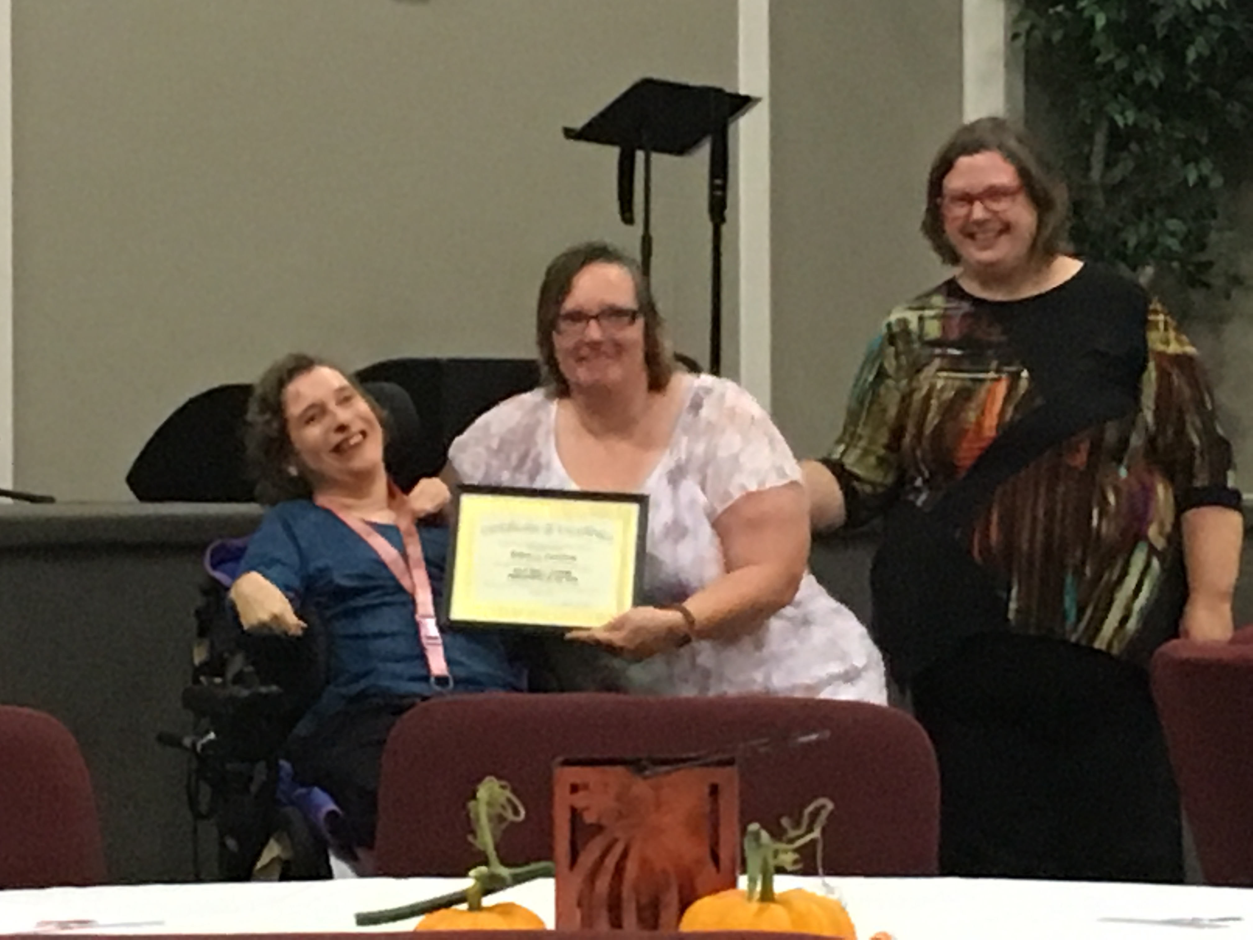 Photo of Rebecca Peterson and Nancy P accepting DSP of the Year 2017